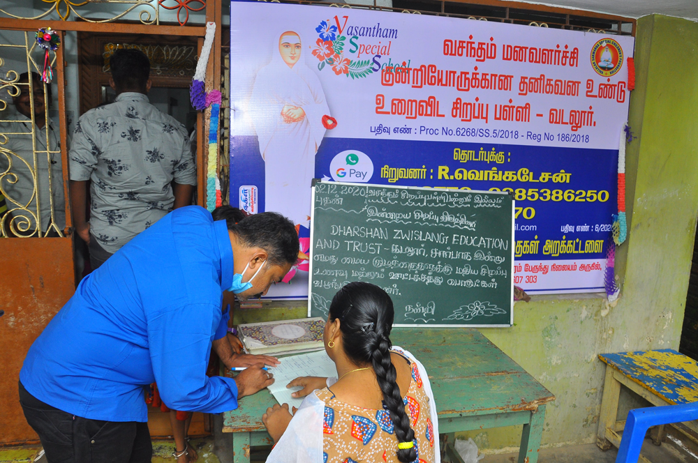 Our Managing Trustee is signing the documents for food donation receipts