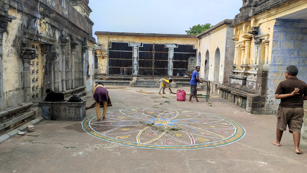 Cleaning the Praharam (Surrounding area) of the temple